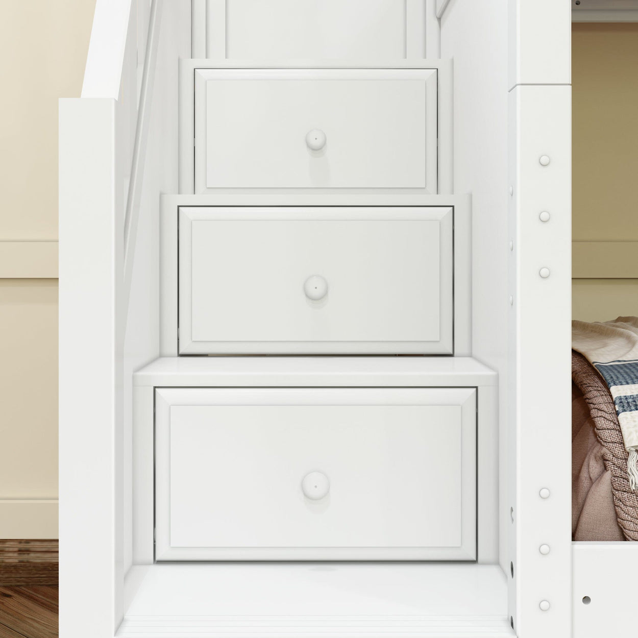 White storage staircase with three drawers, integrated into a bunk bed for space-saving bedroom organization.