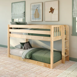 Solid natural wood twin-over-twin bunk bed with built-in ladder, green bedding and plush toy in a cozy kids' bedroom with framed wall art