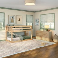 Bright children's bedroom with natural wood twin bunk bed, green bedding, matching dresser, striped Roman shades, play rug and wooden toy plane