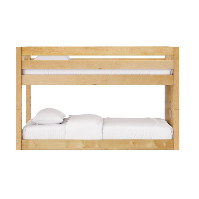 Solid natural wood bunk bed with upper guardrail and white bedding, space-saving kids' bedroom loft in maple finish