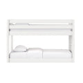 White wooden bunk bed with guardrails and ladder, white bedding in modern kids' bedroom
