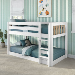 White wooden bunk bed with teal bedding, built-in ladder and under-bed storage drawer in a children's bedroom with striped teal wallpaper, potted plant and stuffed elephant toy.