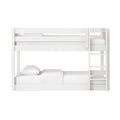 Modern white wooden twin-over-full bunk bed with ladder, natural wood accents and white bedding