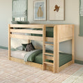 Natural solid wood twin-over-twin bunk bed with green bedding in styled kids' bedroom, striped roman shades, framed wall art and plush toy