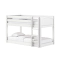 White wooden bunk bed with ladder and safety rails, modern loft-style kids bed with white bedding