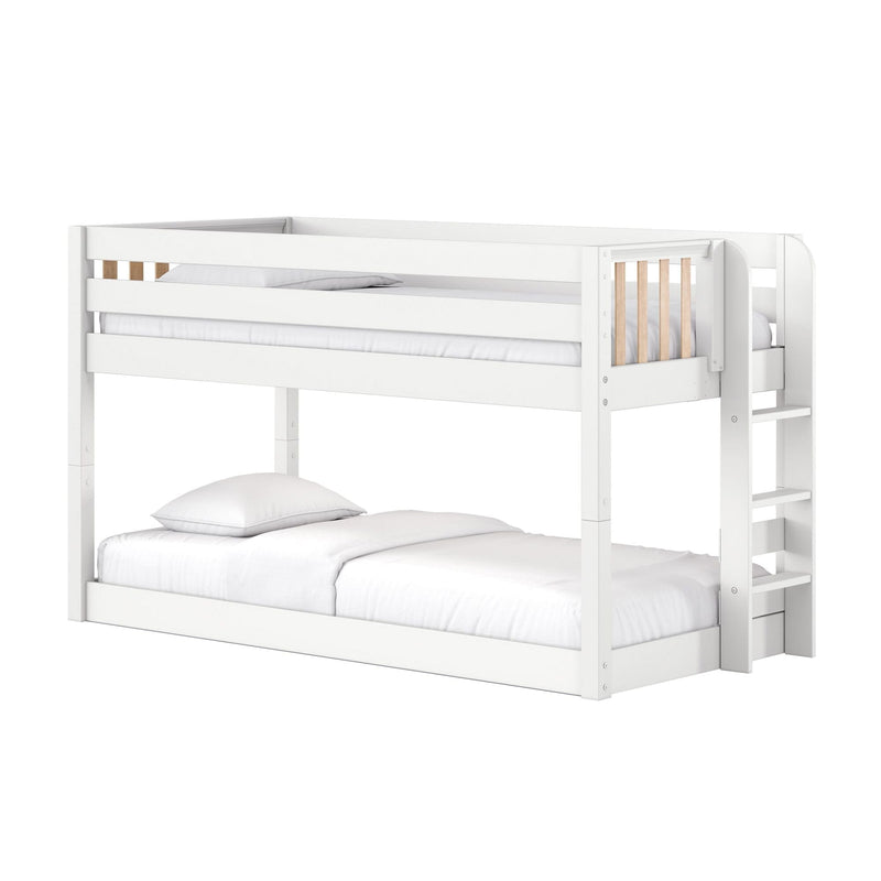 White wooden twin-over-full bunk bed with ladder, guardrail and slatted panels, white bedding — modern space-saving kids loft bed