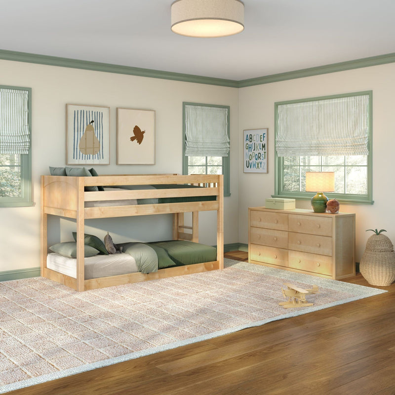 Modern kids bedroom with natural wood bunk bed, green bedding and trim, striped Roman shades, dresser with lamp and alphabet wall art