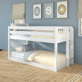 White wooden bunk bed in a modern kids' bedroom with blue walls, yellow striped bedding, car-print sheets, ladder, framed moon and star wall art, and natural woven rug