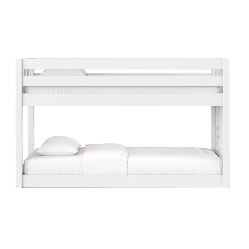 White modern wooden bunk bed with upper guardrail and lower mattress, crisp white bedding, minimalist kids bedroom furniture