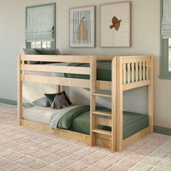 Twin-over-twin solid wood bunk bed with natural finish and ladder in children’s bedroom with green bedding, plush toy, striped Roman shades, and framed pear and bird wall art