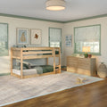 Sunlit children's bedroom with natural wood bunk bed and dresser, green-trimmed windows with striped Roman shades, alphabet wall art and warm bedside lamp