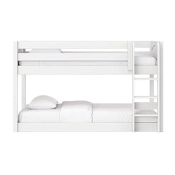 White wooden twin-over-full bunk bed with ladder and safety rails, minimalist white bedding