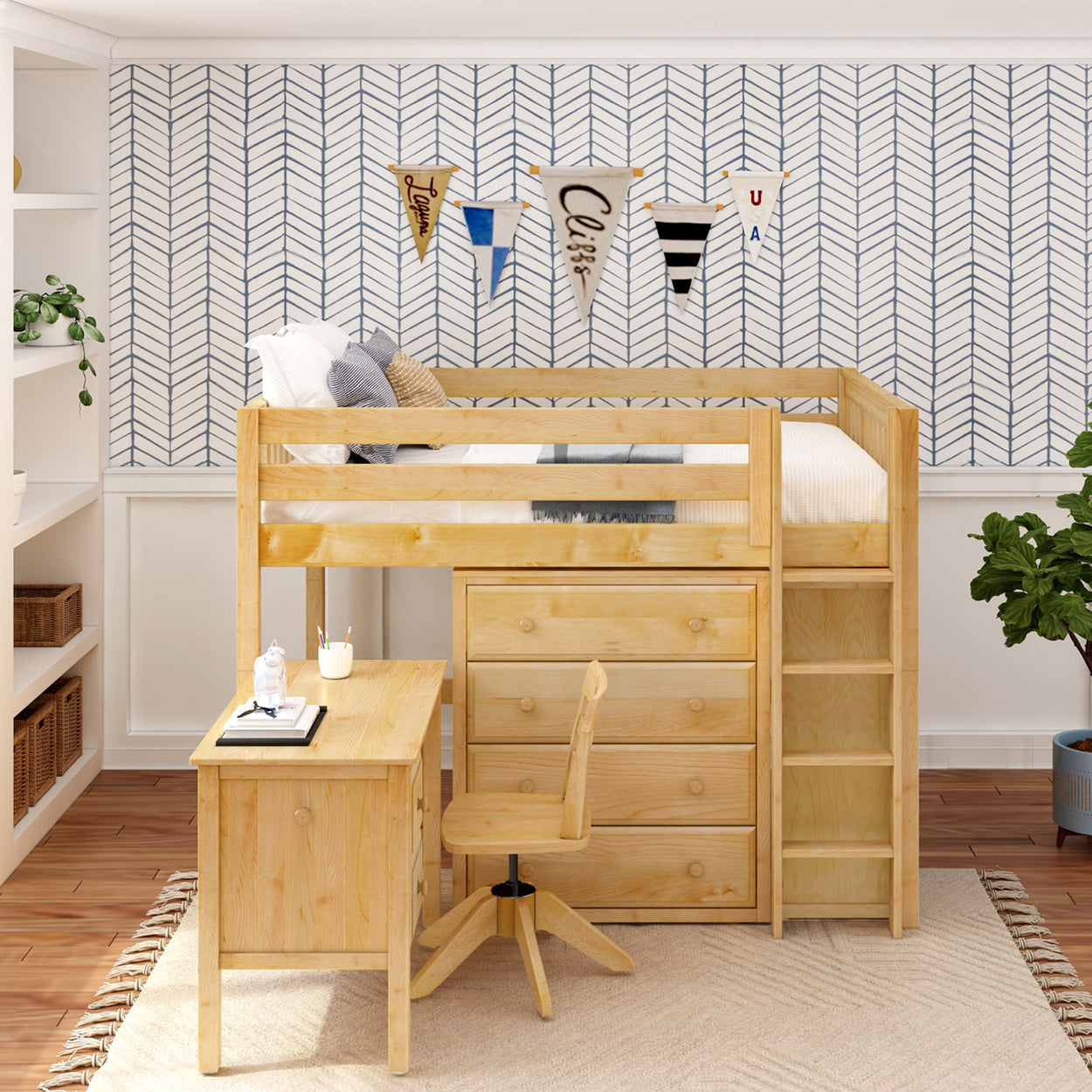 Modern kids' room with wooden loft bed, built-in desk, and storage drawers, featuring chevron pattern wall and decorative pennants.