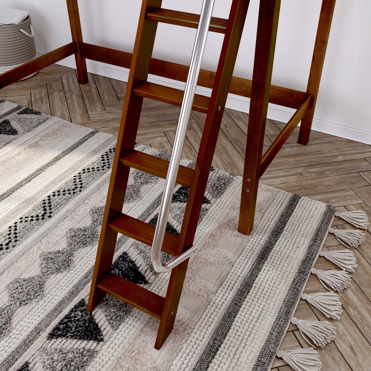 Loft bed wooden ladder on modern patterned rug with herringbone wooden floor.