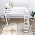 White loft bed with ladder and safety rail, neatly made with white bedding and beige decorative pillows in a minimalist kids' bedroom featuring a patterned tassel rug, herringbone wood floor, woven storage basket and potted plant