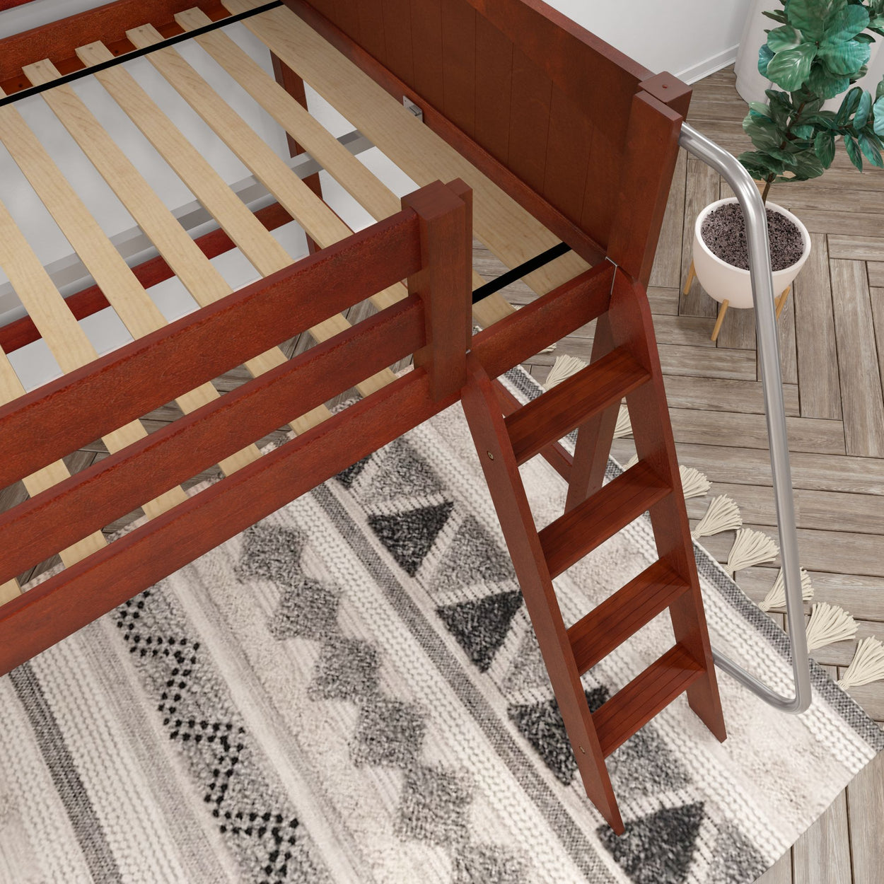 Wooden bunk bed with ladder on patterned rug in modern room.
