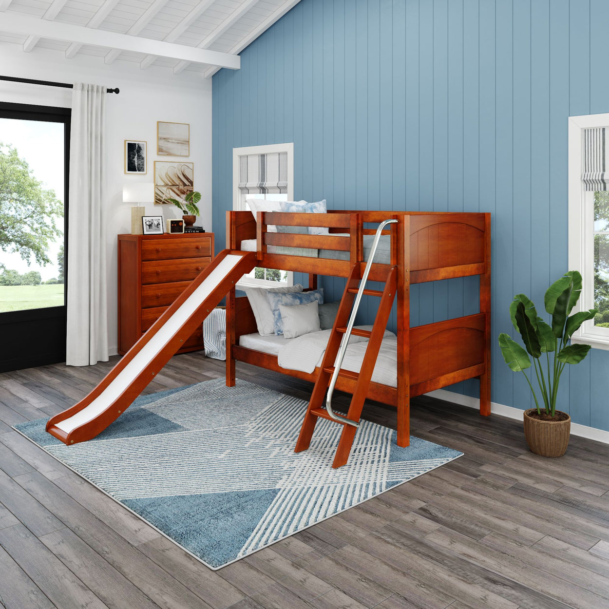 Wooden bunk bed with slide in a modern kids room featuring light blue walls, large window, and a cozy rug.