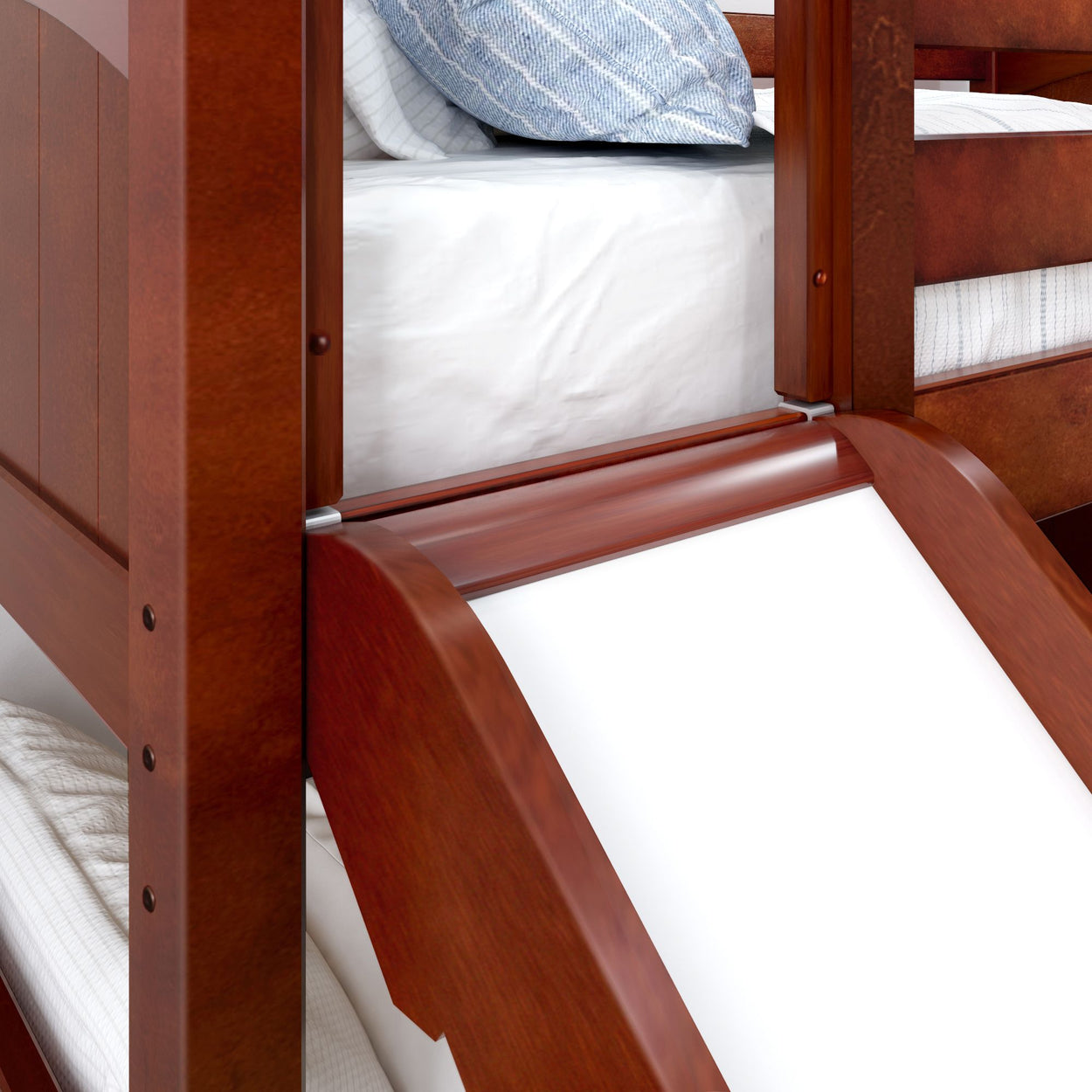 Wooden bunk bed with slide and comfortable bedding.