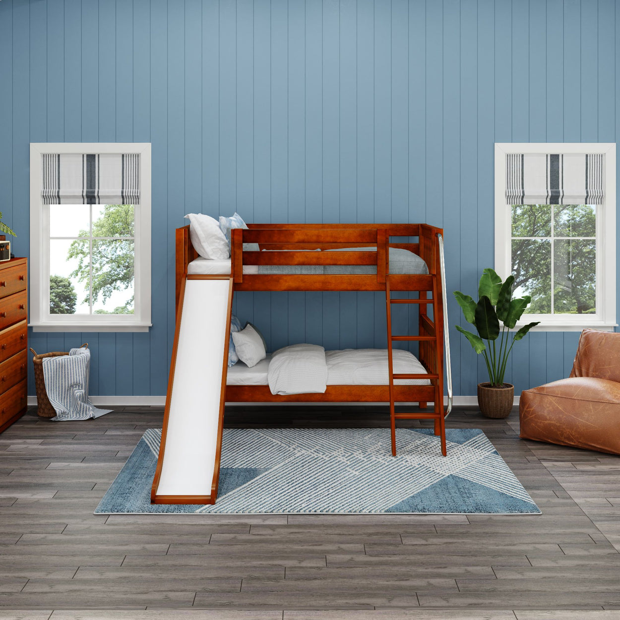 Stylish kids' room with wooden bunk bed featuring a slide and cozy decor in blue and neutral tones.