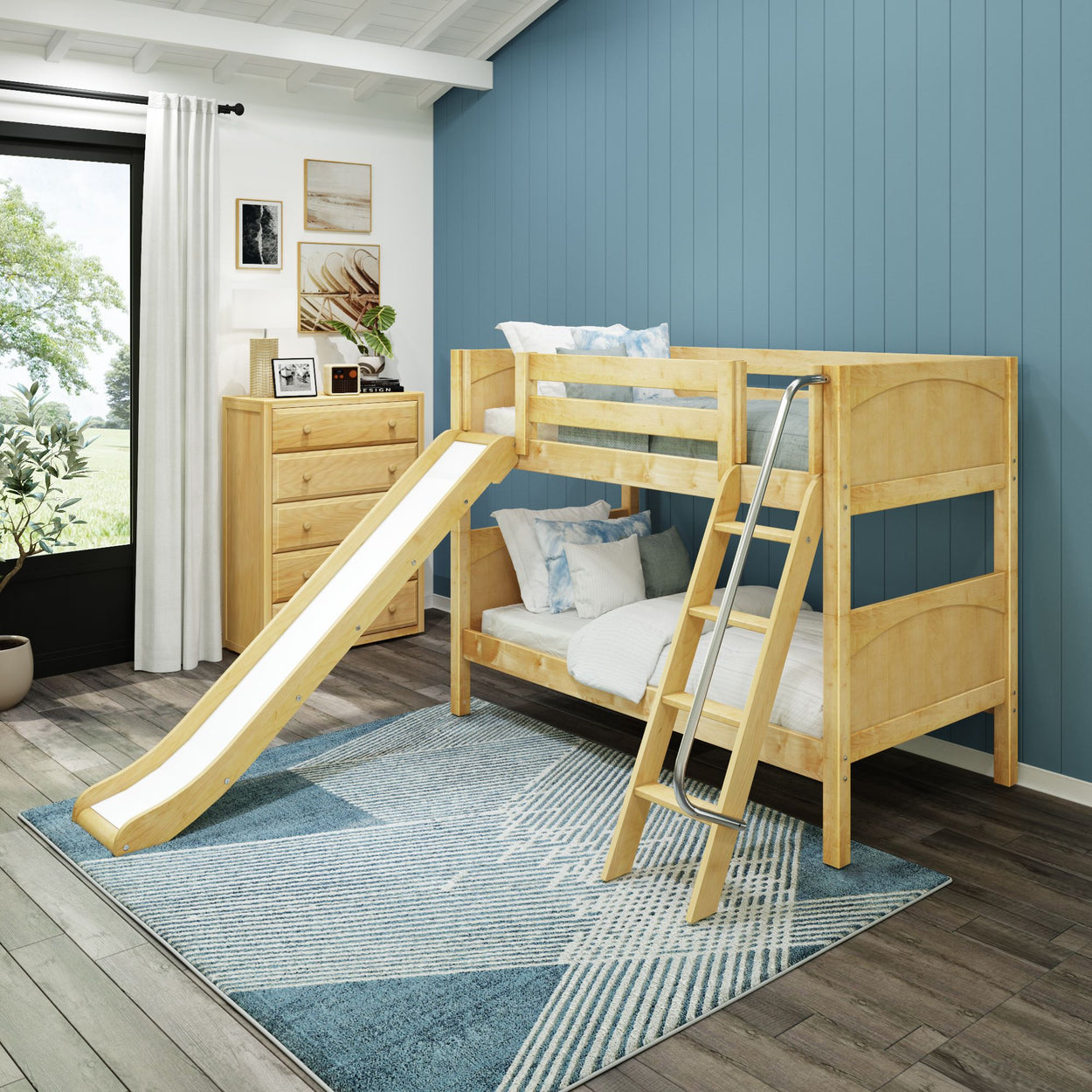Wooden bunk bed with slide and ladder in modern blue-themed children's bedroom.