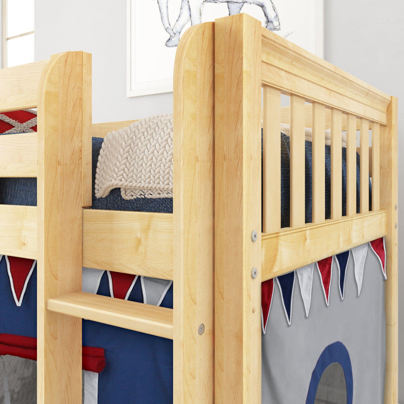 Close-up of solid wood bunk bed with natural maple finish, safety guardrail and ladder, navy and red kids bedding and chunky knit blanket
