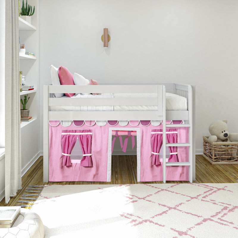White loft bed with pink playhouse curtain underneath in a modern girls' bedroom, white bedding with pink accent pillows, built-in shelving with books and plants, wicker basket teddy bear on hardwood floor, kids room decor
