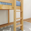 Close-up of natural pine wooden bunk bed ladder and frame with blue mattress, hardwood floor and gray patterned rug in a children's loft bedroom