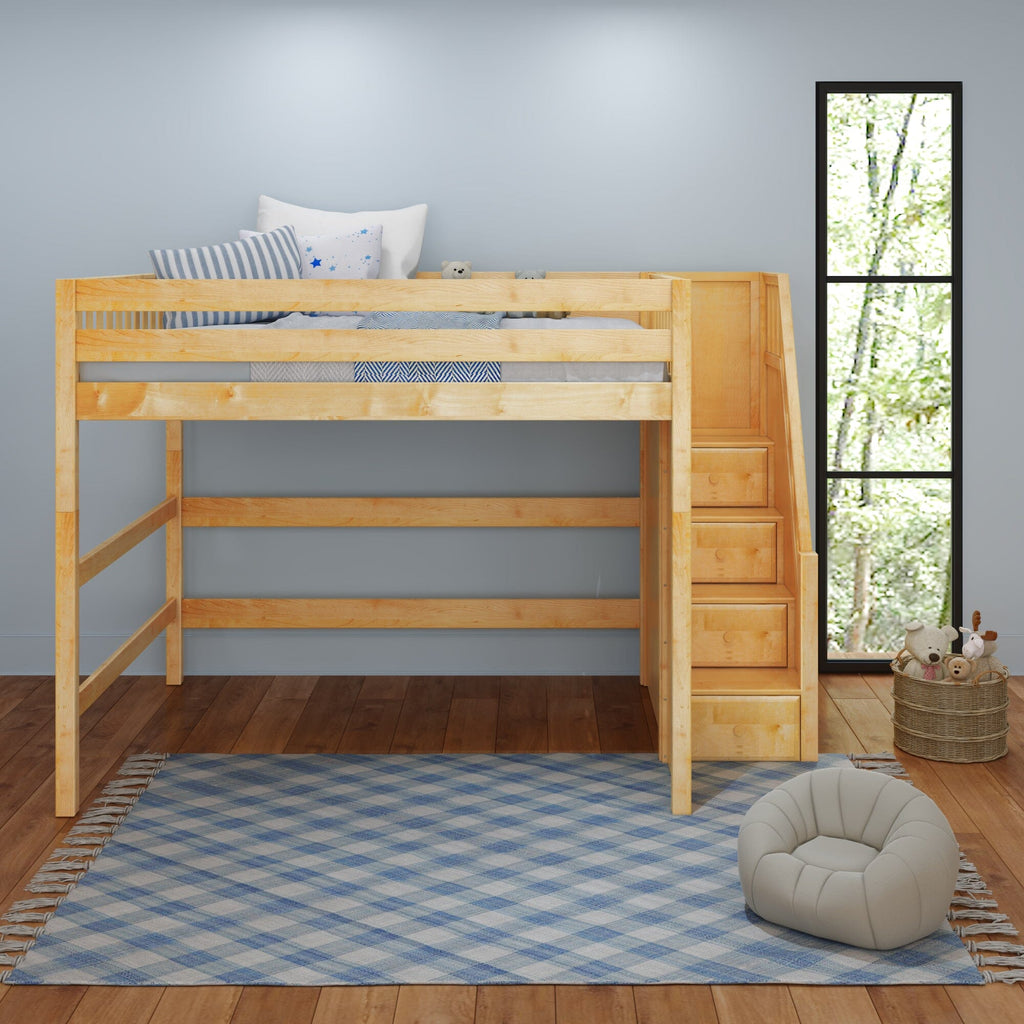 Natural wood children's loft bed with built-in storage stairs above open play area in bright kids' bedroom with blue plaid rug and floor cushion