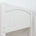 Close-up of white painted wooden arched headboard with vertical slat panel and visible side-rail hardware, modern farmhouse bunk bed guardrail