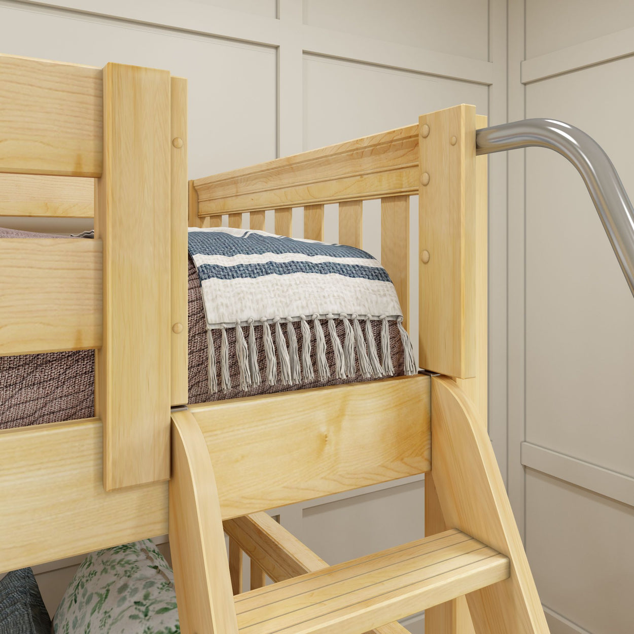 Wooden bunk bed with striped throw blanket draped over railing in a cozy bedroom setting.
