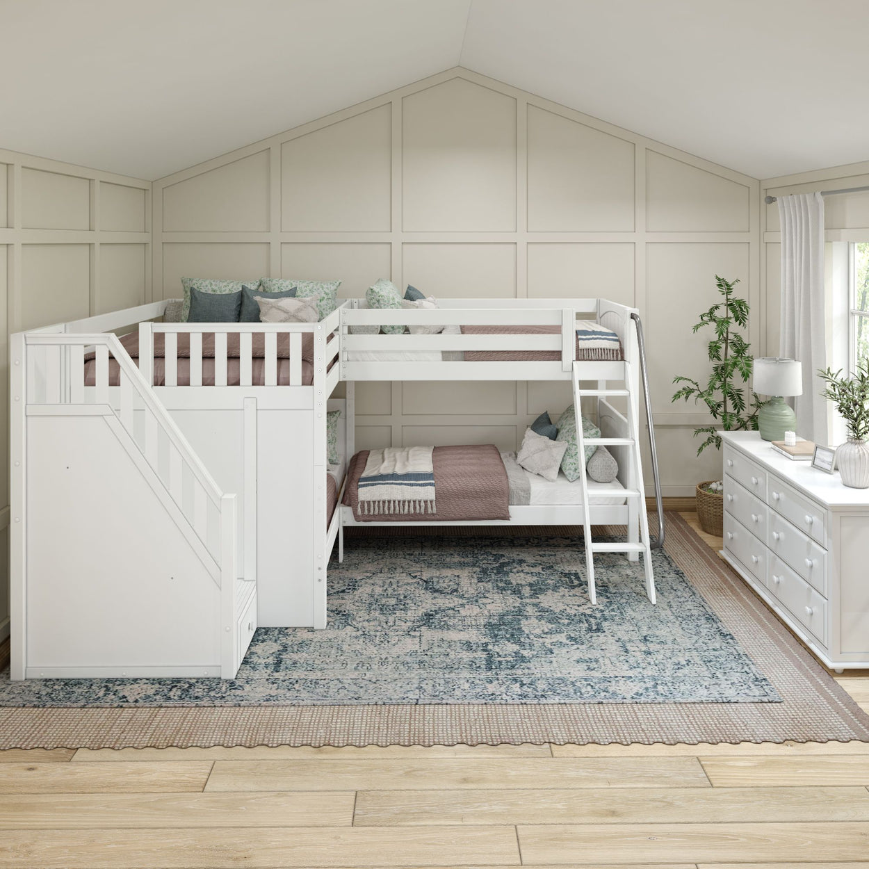 White L-shaped loft bed with stairs in a modern bedroom featuring a decorative rug and green plants.