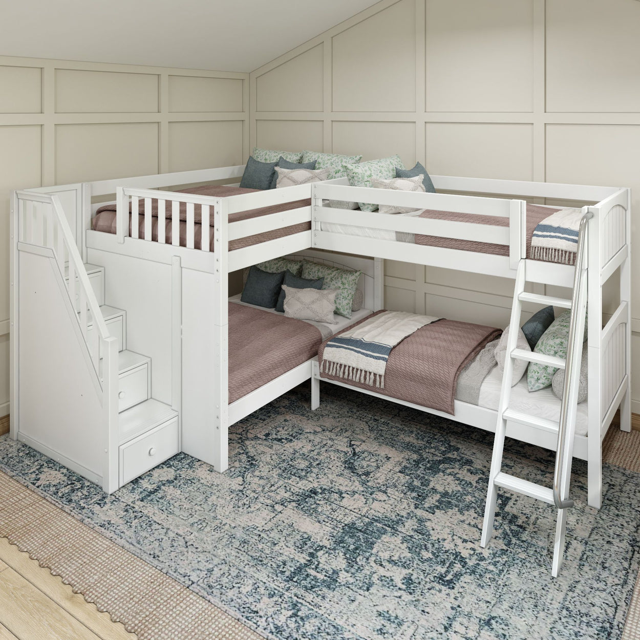 White L-shaped bunk bed with stairs and ladder, featuring cozy pillows and blankets, in a modern bedroom with a patterned blue rug.
