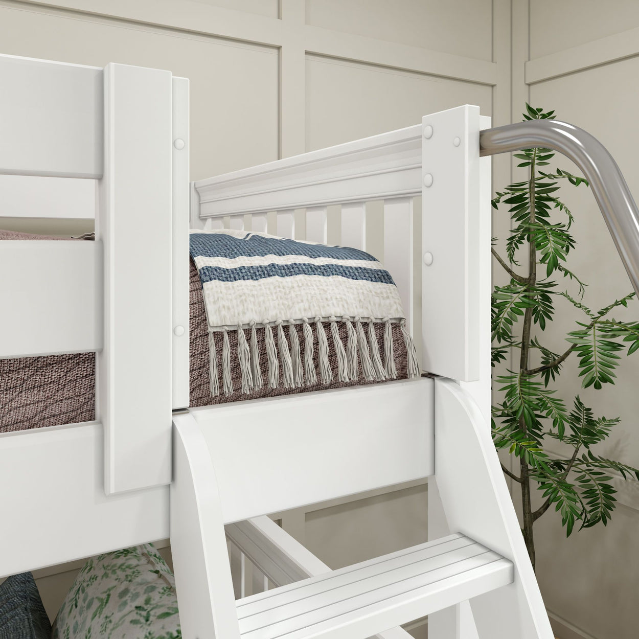 White wooden loft bed with a ladder and cozy throw blanket, featuring an elegant modern bedroom design.