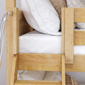 Close-up of wooden bunk bed with natural wood ladder, white striped pillow and crisp white mattress linens for small-space bedrooms