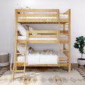 Light natural wood bunk bed with ladder, white linens and pillows in a modern kids' bedroom with decorative rug and potted plant