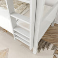Close-up of white wooden bunk bed ladder and side panel with beige plaid bedding and patterned area rug on light wood floor in a modern kids bedroom