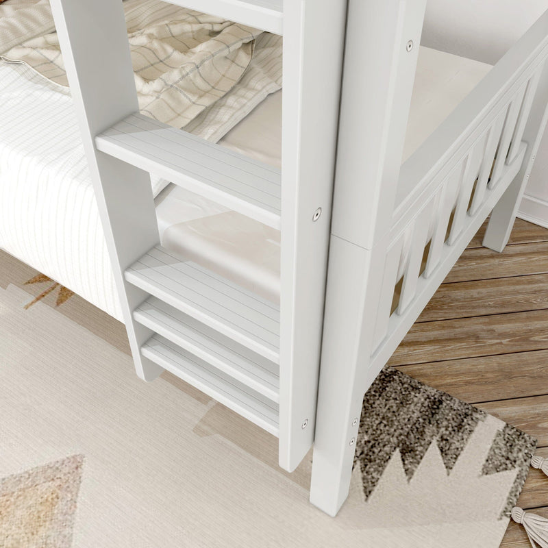 Close-up of a white wooden bunk bed ladder with beige plaid bedding and patterned rug on a hardwood floor in a kids' bedroom