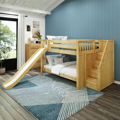 Children's wooden bunk bed with slide and stairs in a modern bedroom, blue accent wall, and natural light.