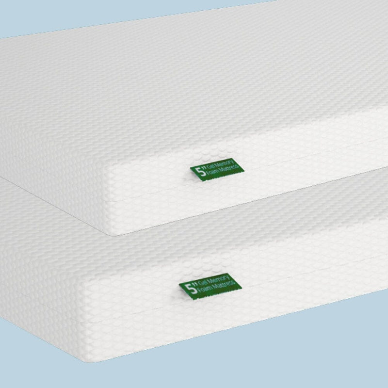Two stacked white Gel Memory Foam mattresses on a blue background.