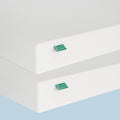 Two white memory foam mattresses stacked, showcasing eco-friendly materials and design.