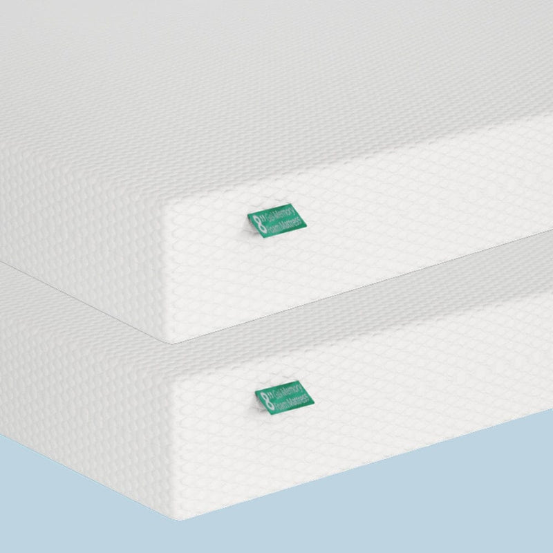 Two white memory foam mattresses stacked, showcasing eco-friendly materials and design.
