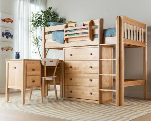 Natural wood loft bed with built-in desk and drawers in kids' bedroom — space-saving twin bed with storage