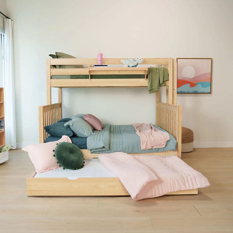 Light wood bunk bed with pull-out lower bed, pastel pink and teal bedding, green round accent pillow and stuffed toy, framed abstract wall art in a bright modern kids' bedroom