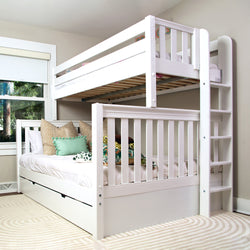 White wooden bunk bed with ladder and cozy bedding in a bright, modern bedroom.