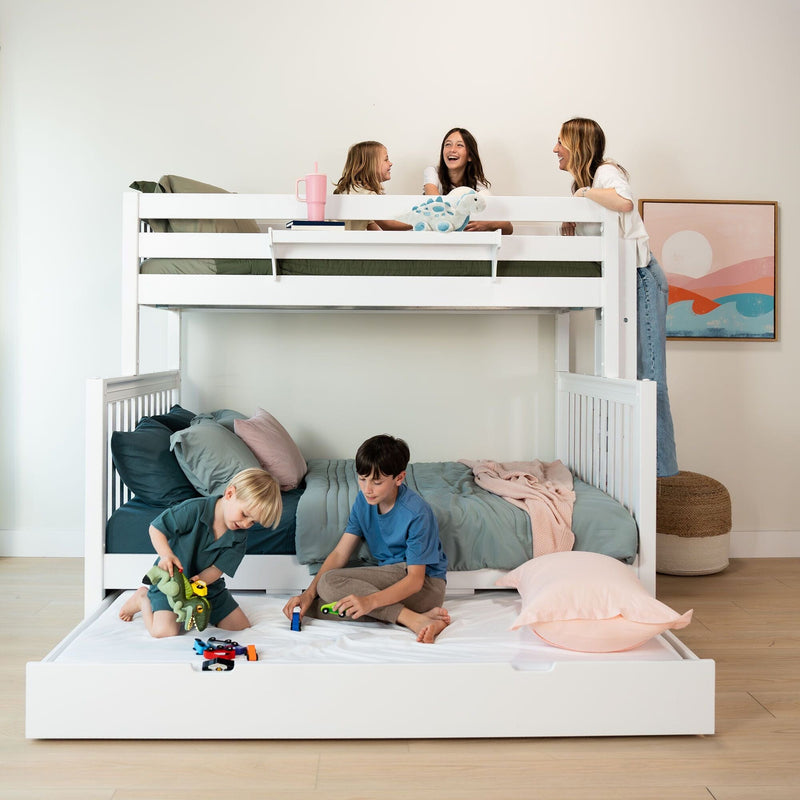 Children playing on a white bunk bed with teal bedding and toy cars while a parent chats on the top bunk in a bright modern shared kids' bedroom