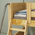 Natural pine bunk bed ladder with metal handrail, wooden safety rail, and striped blue-white blanket close-up