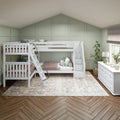 Kids bedroom with white twin-over-twin bunk beds and stair-storage, sage green paneled accent wall, white dresser, area rug and herringbone wood floor