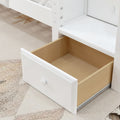 Open white pull-out under-bed storage drawer with wood interior and round knob on light laminate floor, modern bedroom storage solution