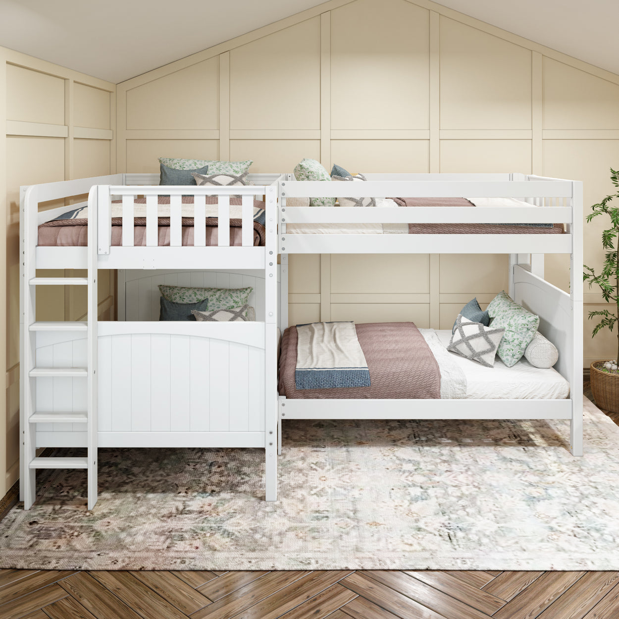 White wooden triple bunk bed with cozy pillows and blankets in a modern bedroom setting, featuring a light beige wall and patterned rug.