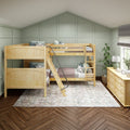 Wooden bunk beds in a cozy kids' bedroom with sage green paneled accent wall, vaulted ceiling, natural wood dresser and houseplants
